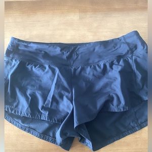 Lulu 2.5 navy blue speed up shorts.